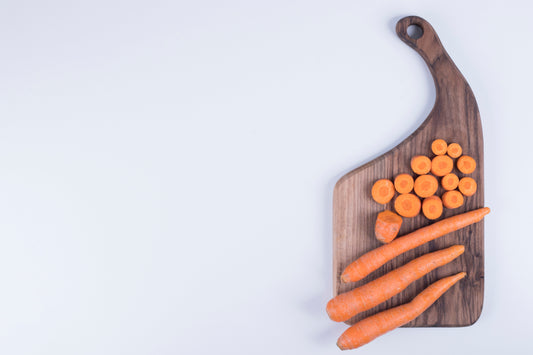 Dog eating raw carrot treat – healthy low-calorie snack